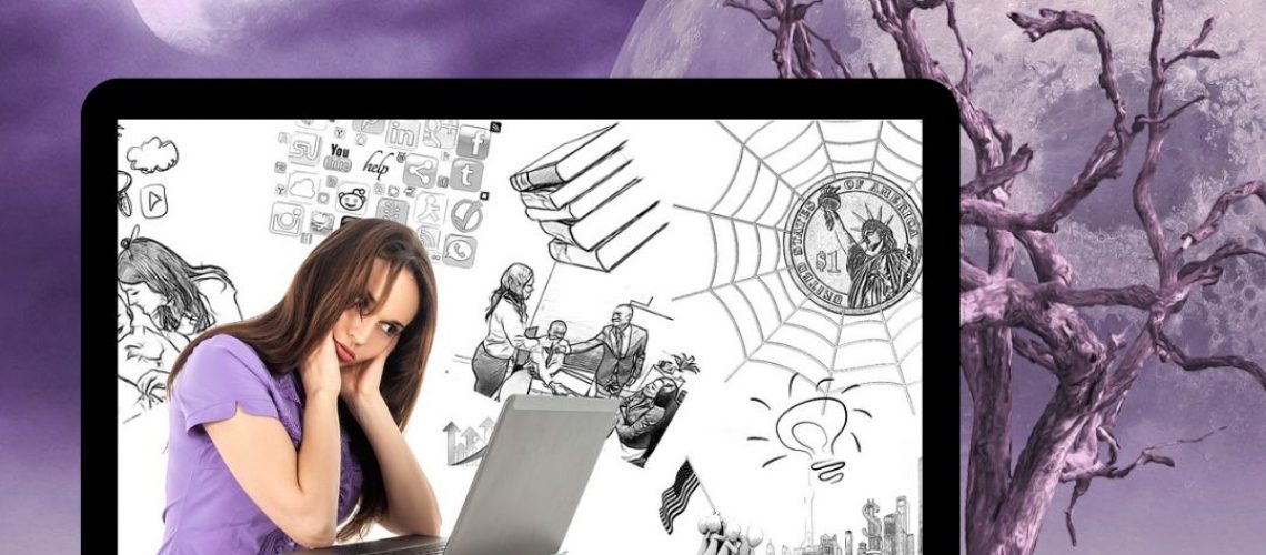 Feature image - writerly stuff A gilrwith long brown hair wearing a purple top sits iin front of a laptop holding her head.
